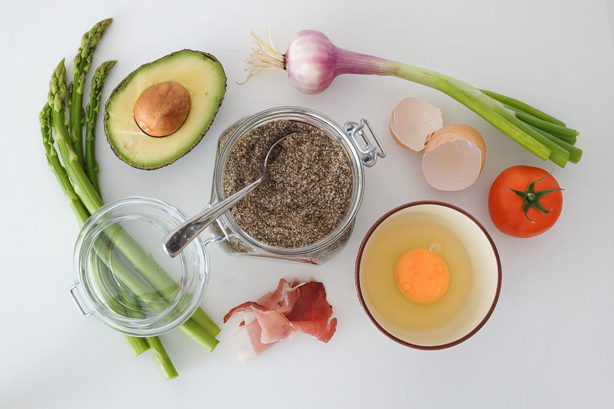 Avocado and fresh ingredients on a table