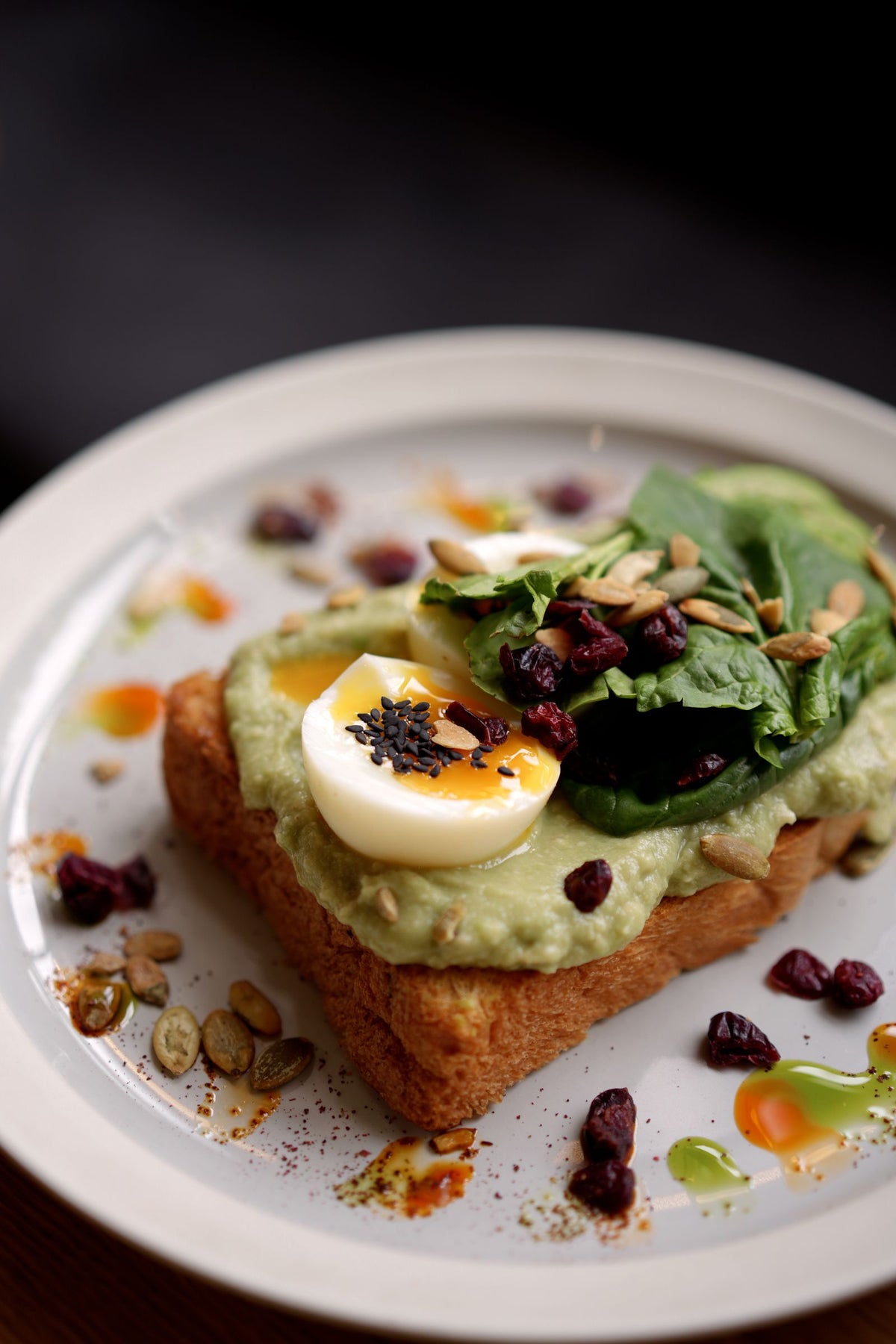 Avocado toast with egg, spinach and seeds