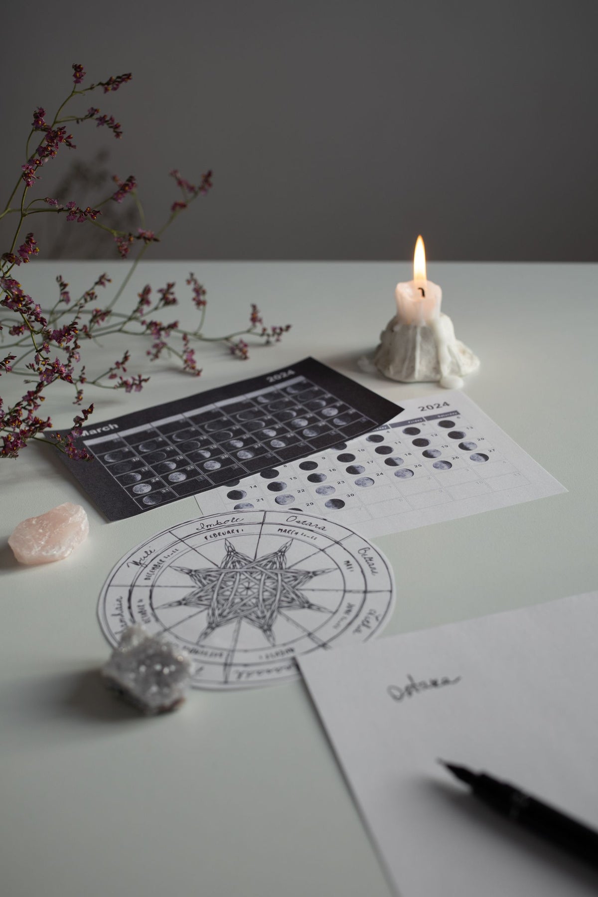 Moon phases calendar with a candle