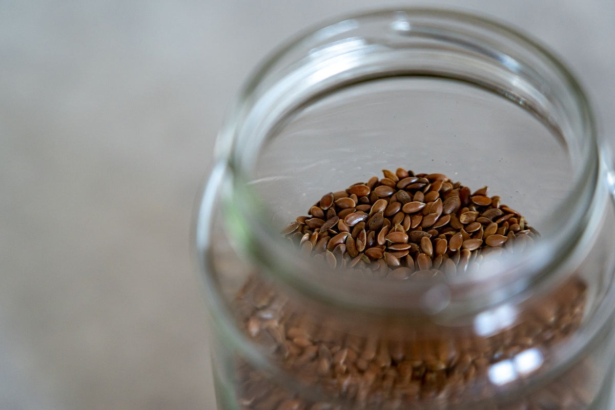 Glass jar filled with flax seeds