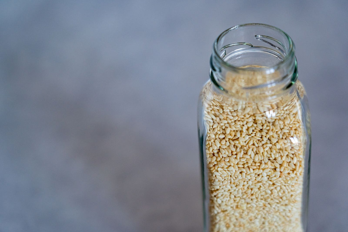 Glass jar filled with sesame seeds
