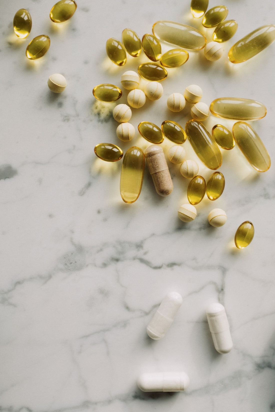 Pills and supplements on marble