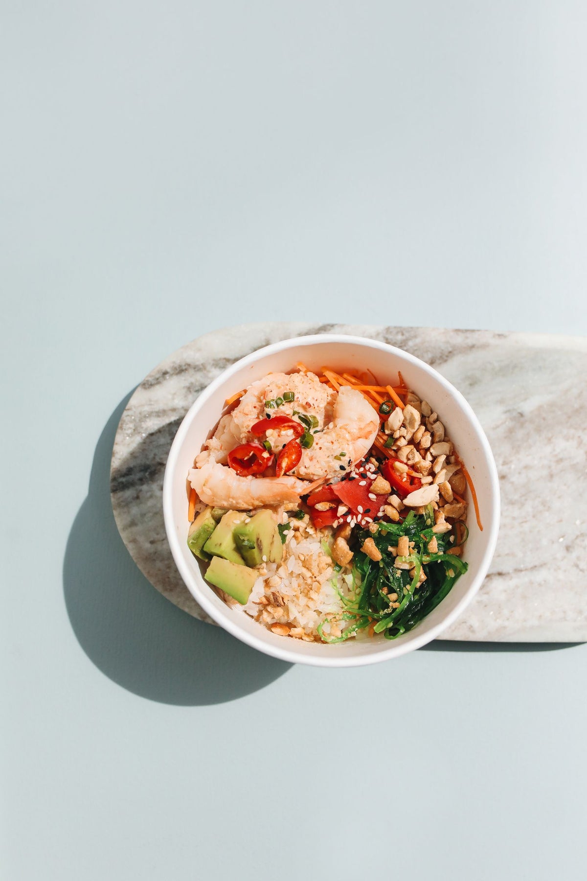 Poke bowl with salmon and avocado