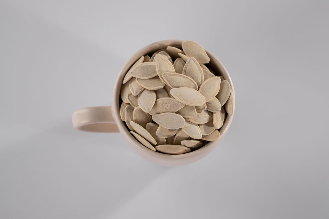 Pumpkin seeds in a white mug