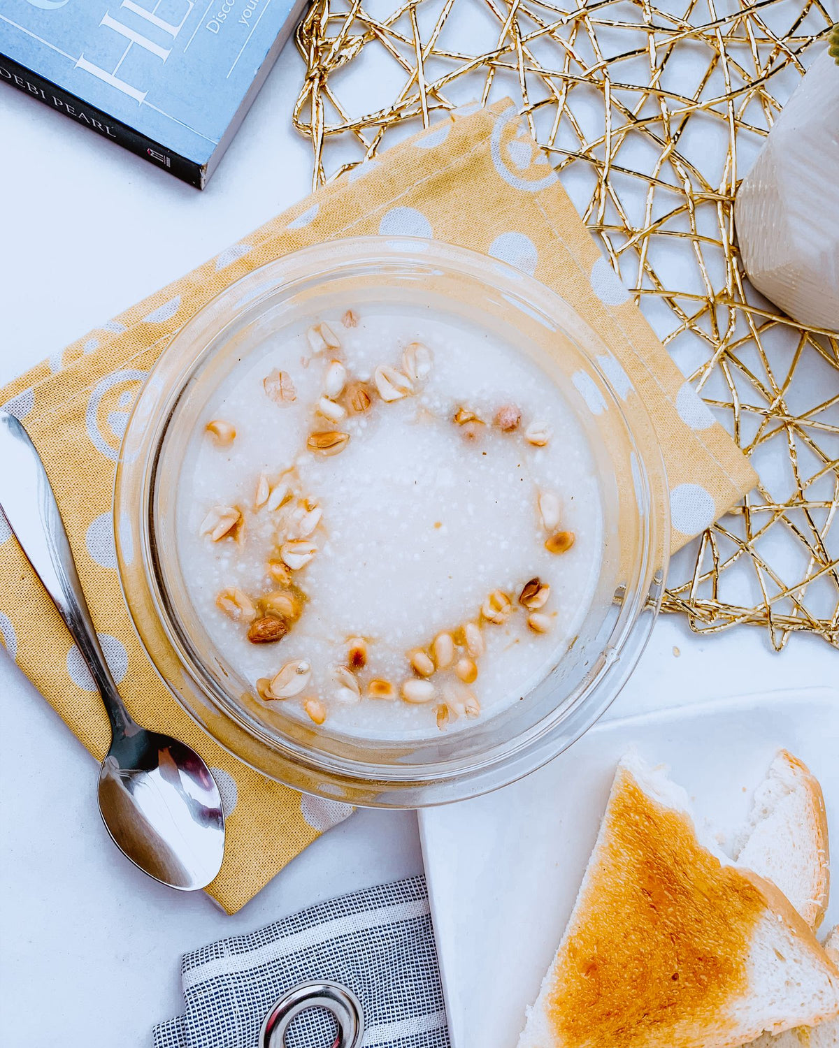 Oatmeal bowl with nuts and toast