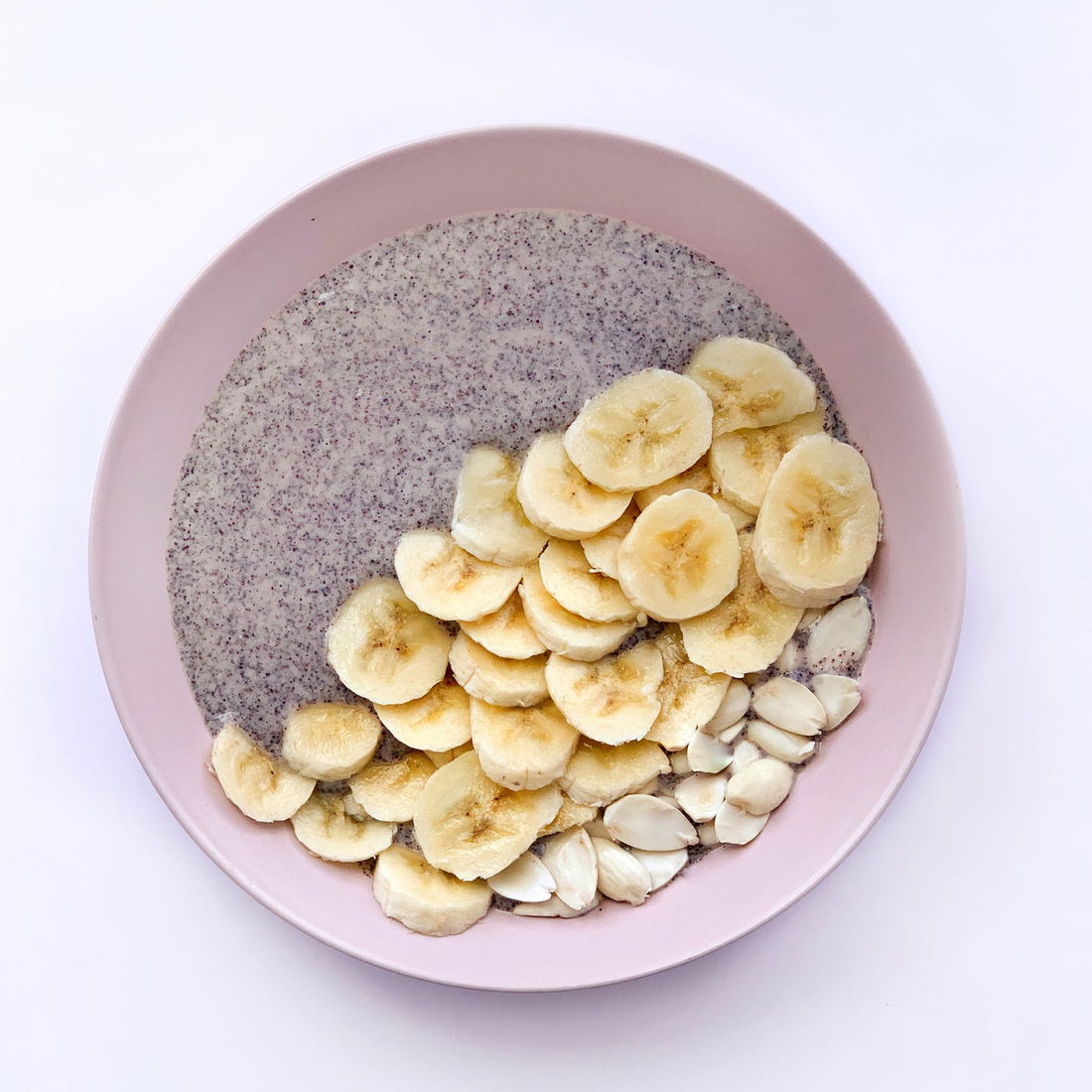 Breakfast bowl with banana, nuts and seeds