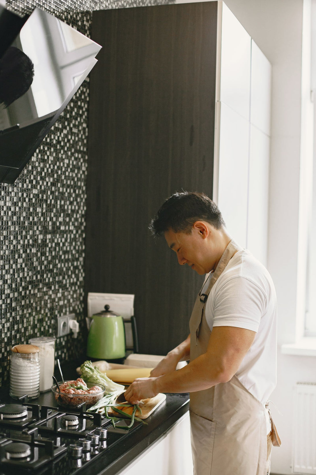 Man slicing vegetables in a kitchen
