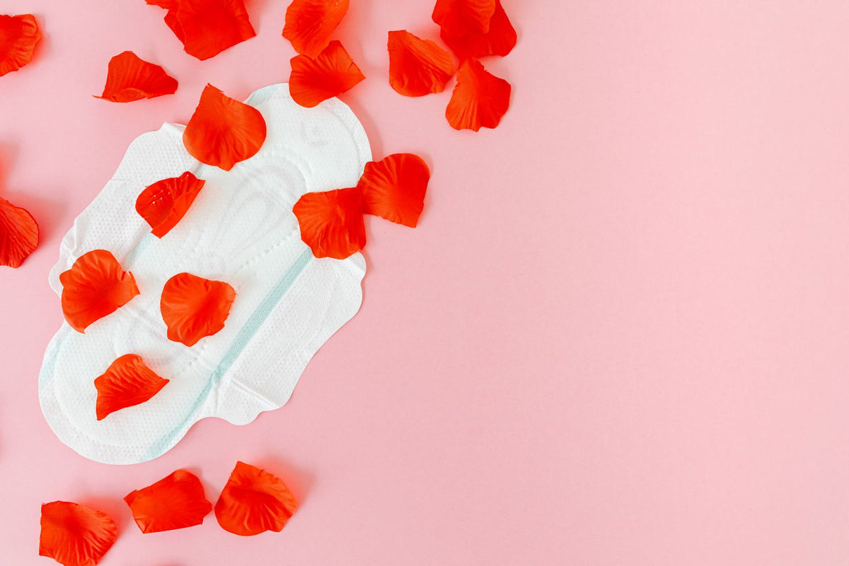 Sanitary pad surrounded by red petals