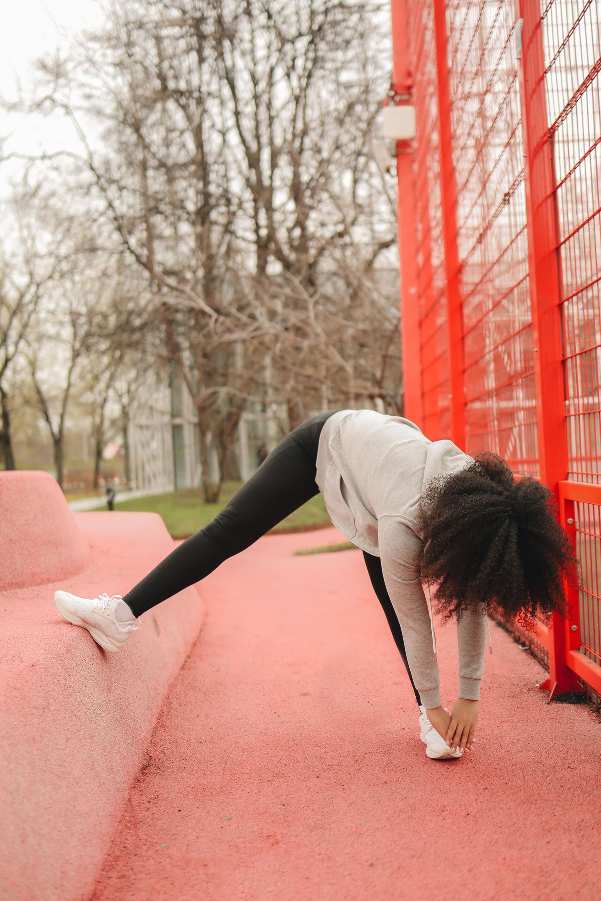 Woman stretching outdoors in a park