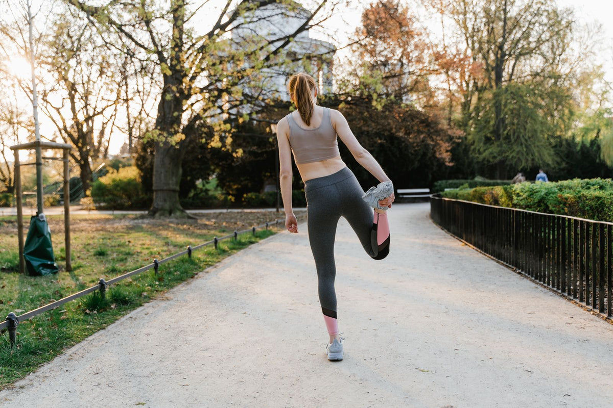 Woman stretching in a park