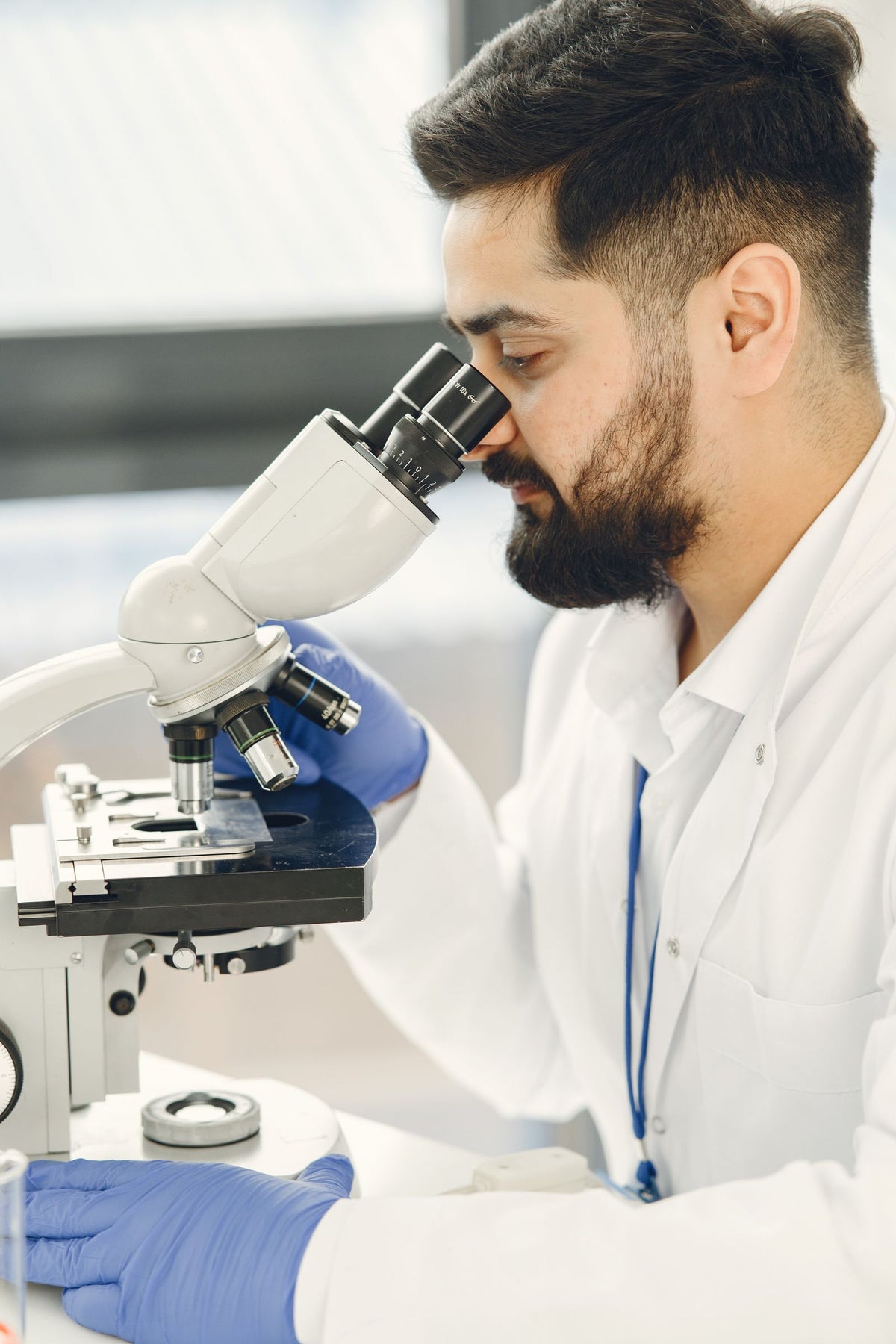 Scientist looking through a microscope