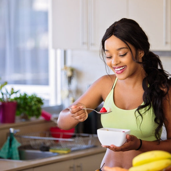 woman smiling with breakfast