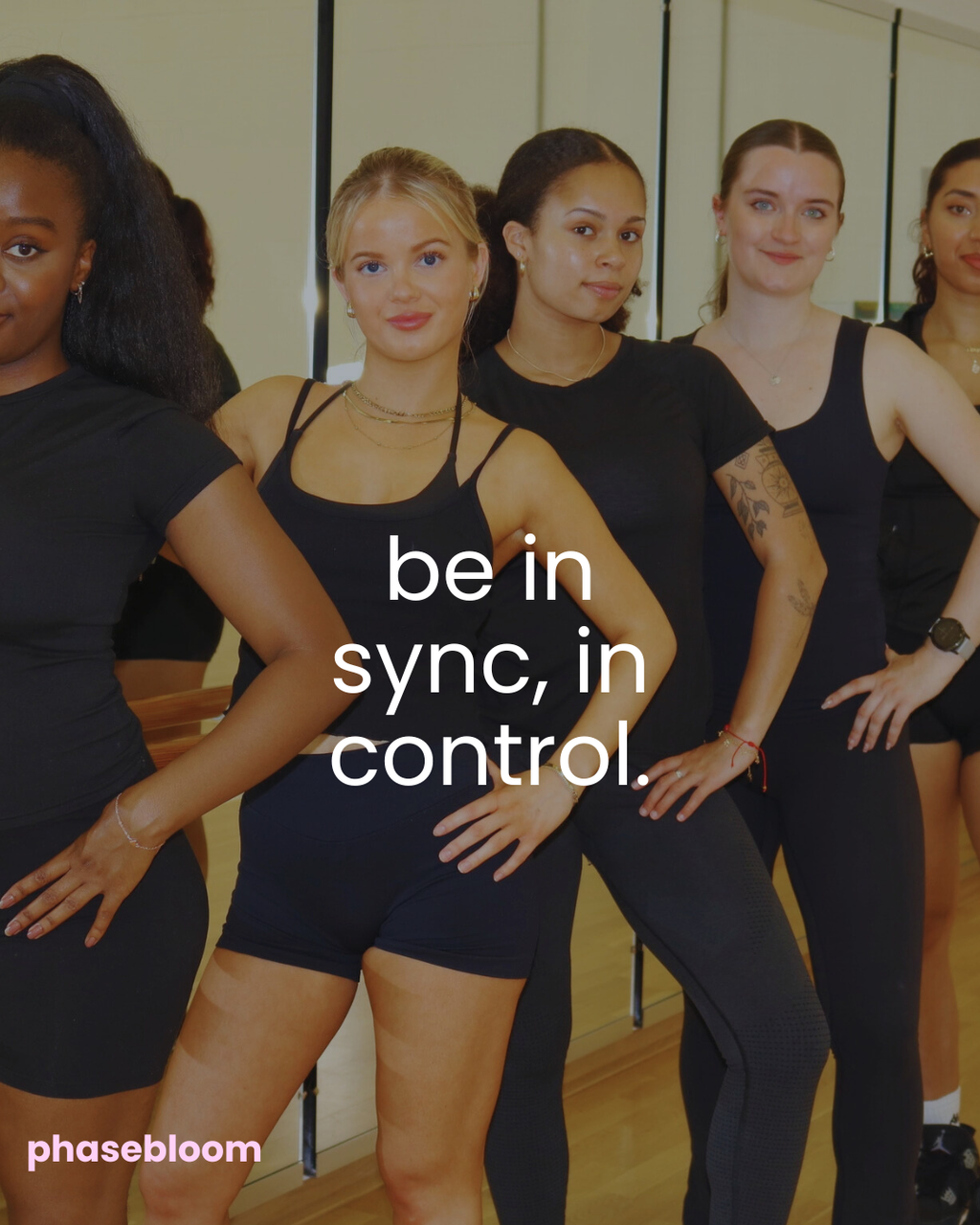 A group of women in black activewear posing together in a studio setting, with the text 'be in sync, in control.' overlaid in the center and 'phasebloom seed cycling kit' in the bottom-left corner.